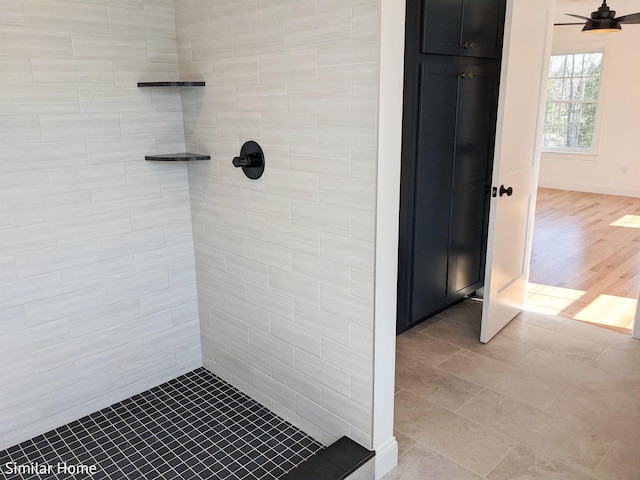 LOT7-3 Sanborn Mdw Unit 7-3, Fremont, NH 03044 - bathroom featuring tiled shower and baseboards