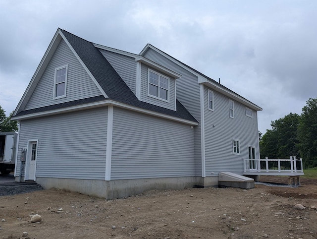 LOT7-3 Sanborn Mdw Unit 7-3, Fremont, NH 03044 - view of property exterior featuring a wooden deck and roof with shingles