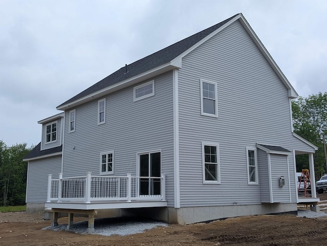 LOT7-3 Sanborn Mdw Unit 7-3, Fremont, NH 03044 - rear view of house with a wooden deck and roof with shingles