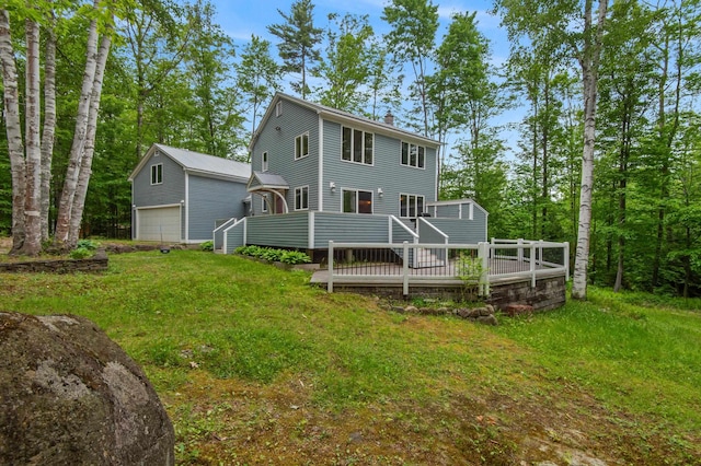180 Ash St, Conway, NH 03860 - back of property with a garage, a wooden deck, a chimney, an outdoor structure, and a yard