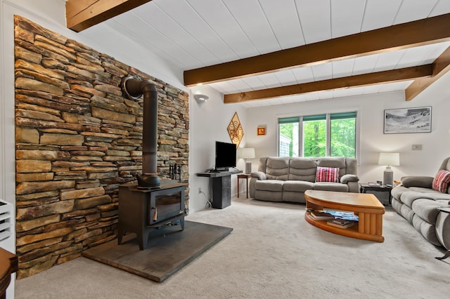 180 Ash St, Conway, NH 03860 - living area featuring carpet floors, a wood stove, and beamed ceiling