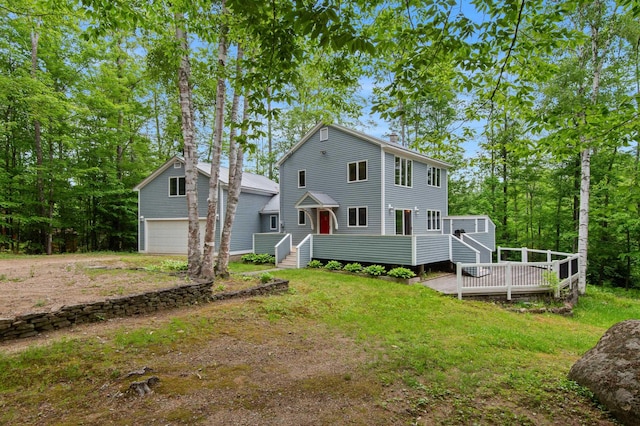 180 Ash St, Conway, NH 03860 - back of house with a deck, a detached garage, and an outdoor structure