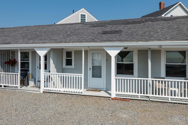 522 Ocean Blvd Unit 10, Hampton, NH 03842 - property entrance featuring a porch and roof with shingles