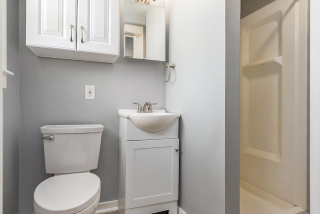 522 Ocean Blvd Unit 10, Hampton, NH 03842 - bathroom featuring a stall shower, vanity, and toilet
