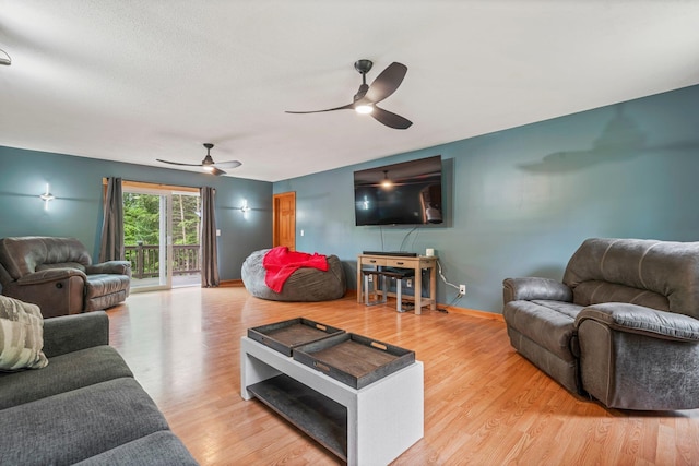 290 Cornish Tpke, Newport, NH 03773 - living room featuring ceiling fan, light wood-style flooring, and baseboards