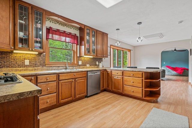 290 Cornish Tpke, Newport, NH 03773 - kitchen featuring stainless steel appliances, a sink, a peninsula, and brown cabinets