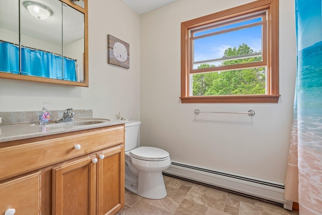 290 Cornish Tpke, Newport, NH 03773 - bathroom with a baseboard radiator, vanity, toilet, and a shower with shower curtain