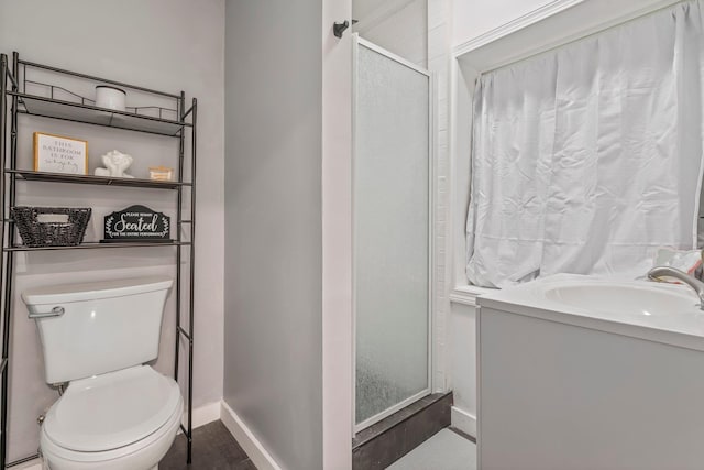 290 Cornish Tpke, Newport, NH 03773 - bathroom featuring toilet, a stall shower, baseboards, and vanity