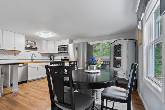 414 Blueberry Ln, Conway, NH 03860 - dining room with light wood-type flooring