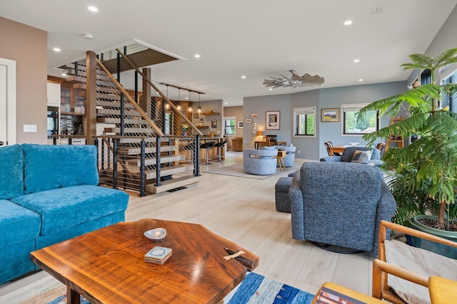 111 Nh Route 4a, Enfield, NH 03748 - living area featuring stairs, recessed lighting, light wood finished floors, and a ceiling fan