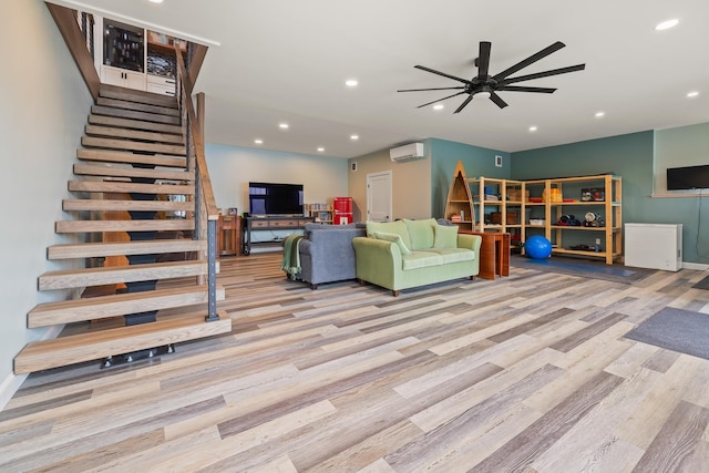 111 Nh Route 4a, Enfield, NH 03748 - living area featuring a wall unit AC, wood finished floors, stairway, a ceiling fan, and recessed lighting
