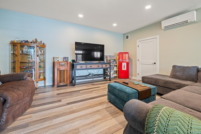 111 Nh Route 4a, Enfield, NH 03748 - living area featuring a wall unit AC, wood finished floors, recessed lighting, and baseboards