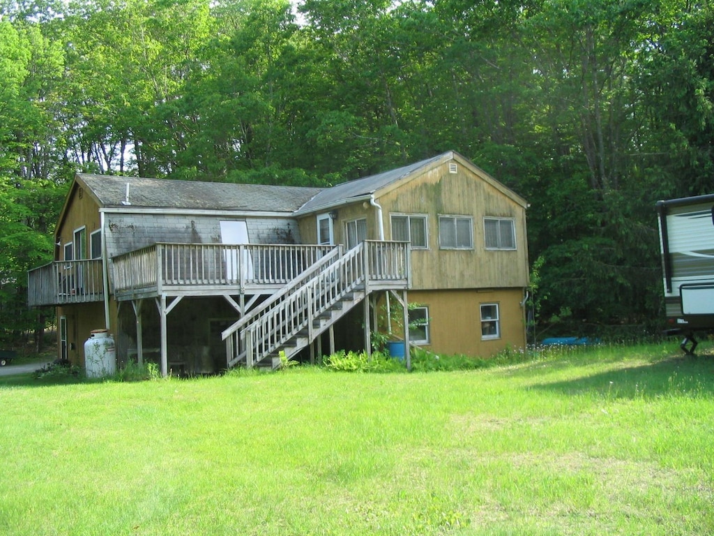 661AND663 Hancock Rd, Harrisville, NH 03450 - back of property with a deck and a yard