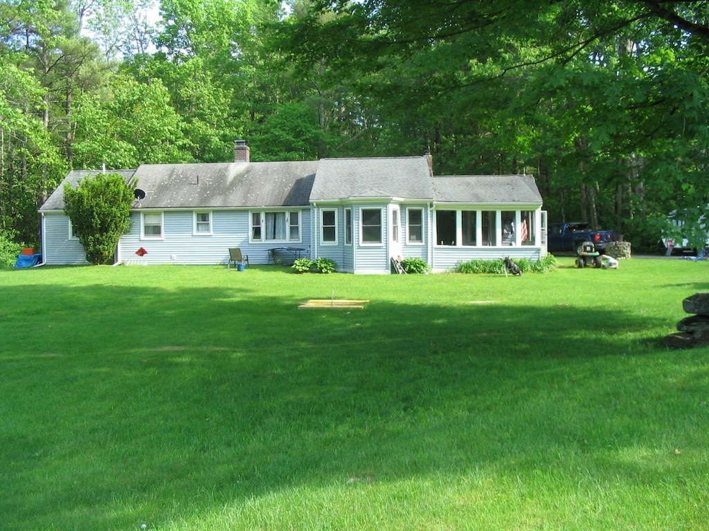 661AND663 Hancock Rd, Harrisville, NH 03450 - single story home with a front yard and a chimney