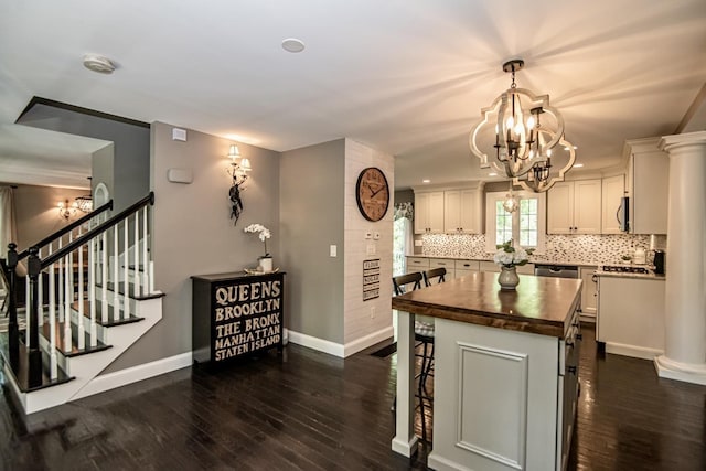 4 Crossman Cir, Newton, NH 03858 - kitchen with butcher block countertops, a chandelier, dark wood-type flooring, decorative backsplash, and recessed lighting