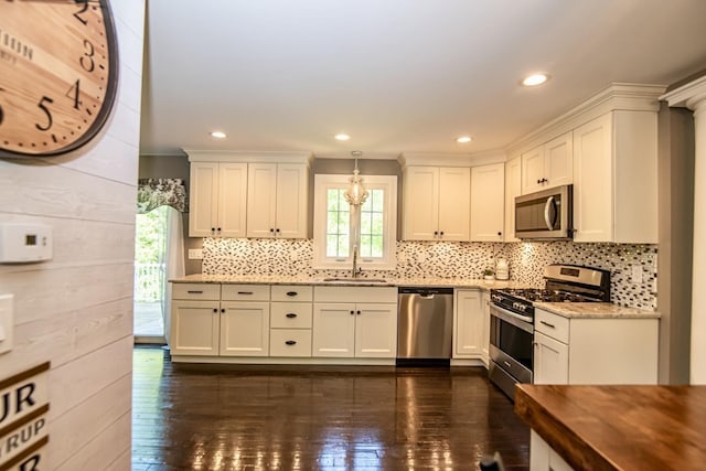 4 Crossman Cir, Newton, NH 03858 - kitchen with appliances with stainless steel finishes, a sink, decorative backsplash, dark wood-style flooring, and recessed lighting