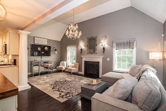 4 Crossman Cir, Newton, NH 03858 - living area with dark wood-type flooring, a fireplace, ornate columns, a chandelier, and baseboards