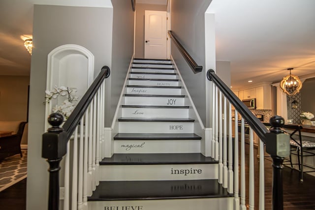 4 Crossman Cir, Newton, NH 03858 - staircase featuring wood finished floors, a chandelier, and recessed lighting