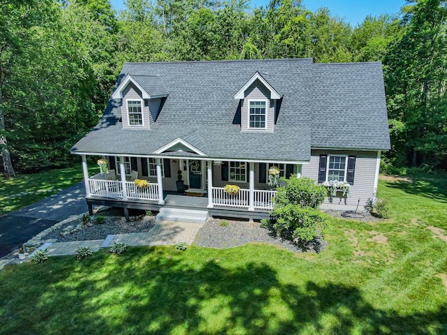 4 Crossman Cir, Newton, NH 03858 - cape cod home featuring covered porch, roof with shingles, and a front lawn