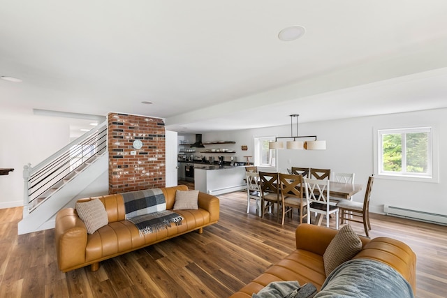 6 Paquette Ln, Sunapee, NH 03782 - living area with healthy amount of natural light, stairway, and wood finished floors
