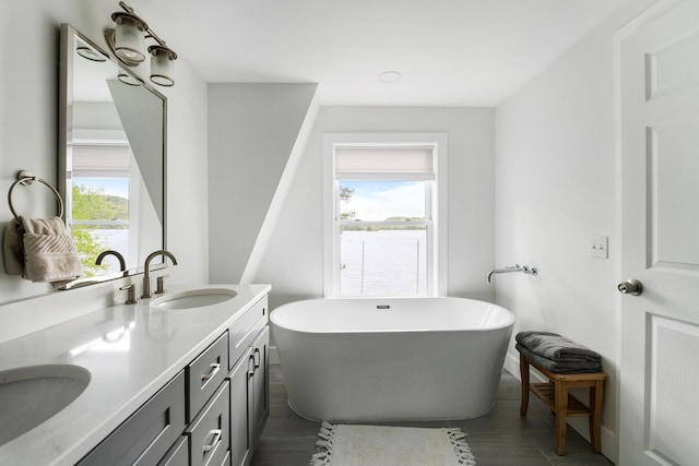 6 Paquette Ln, Sunapee, NH 03782 - bathroom featuring double vanity, healthy amount of natural light, and a soaking tub