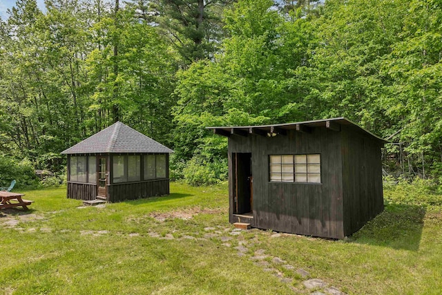 230 Pine Hill Rd, Ossipee, NH 03864 - view of shed featuring a wooded view and a sunroom