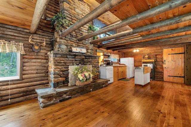 230 Pine Hill Rd, Ossipee, NH 03864 - unfurnished living room with light wood-type flooring, rustic walls, and wooden ceiling with exposed beams