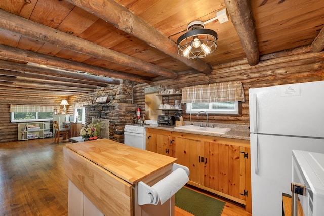 230 Pine Hill Rd, Ossipee, NH 03864 - kitchen with white appliances, rustic walls, a sink, wooden counters, and wood ceiling with exposed beams