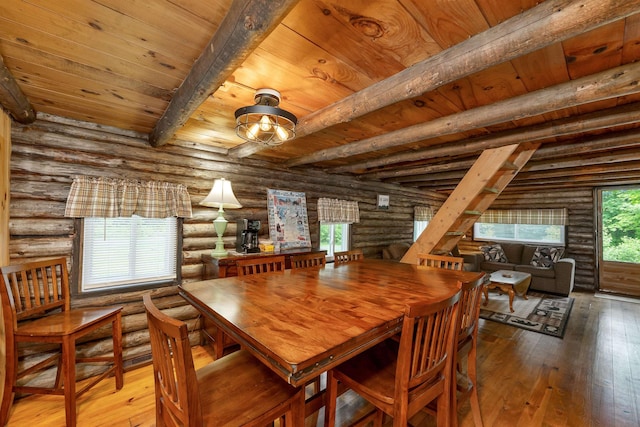230 Pine Hill Rd, Ossipee, NH 03864 - dining area featuring rustic walls, wood-type flooring, and wood ceiling with exposed beams
