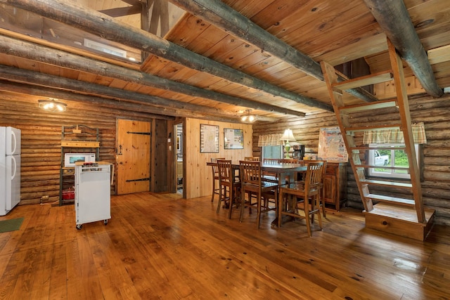 230 Pine Hill Rd, Ossipee, NH 03864 - dining area with rustic walls, hardwood / wood-style floors, and wooden ceiling with exposed beams