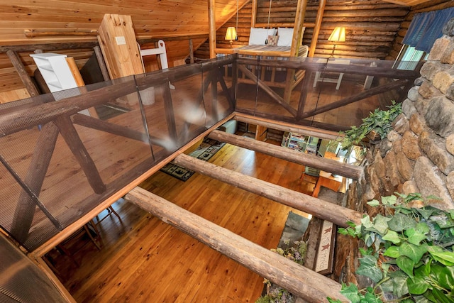 230 Pine Hill Rd, Ossipee, NH 03864 - staircase with rustic walls, wood-type flooring, and lofted ceiling