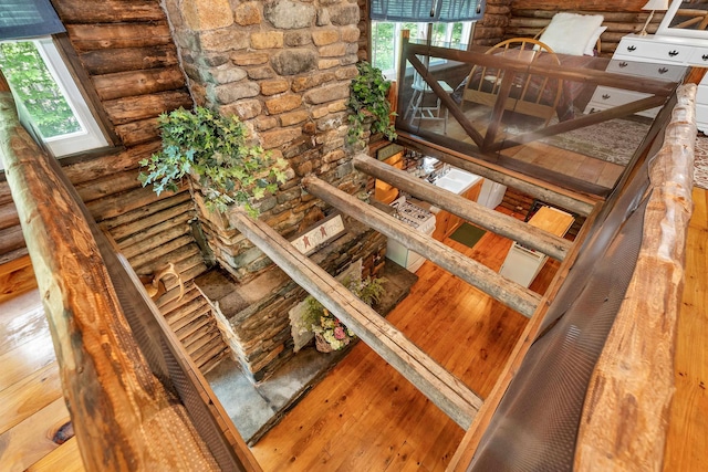 230 Pine Hill Rd, Ossipee, NH 03864 - stairs featuring rustic walls and hardwood / wood-style floors