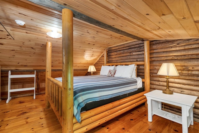 230 Pine Hill Rd, Ossipee, NH 03864 - bedroom with wood ceiling, hardwood / wood-style flooring, log walls, and vaulted ceiling