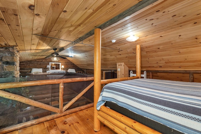 230 Pine Hill Rd, Ossipee, NH 03864 - bedroom with wooden ceiling, vaulted ceiling, log walls, wood-type flooring, and wood walls