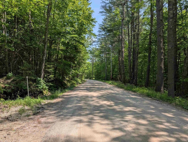 230 Pine Hill Rd, Ossipee, NH 03864 - view of road featuring a wooded view