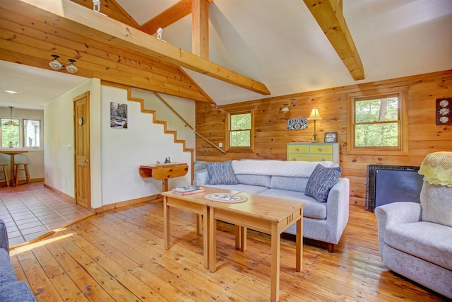 71 Eddie Knoll Ln, Bartlett, NH 03812 - living room featuring beamed ceiling, light wood finished floors, healthy amount of natural light, wood walls, and stairway