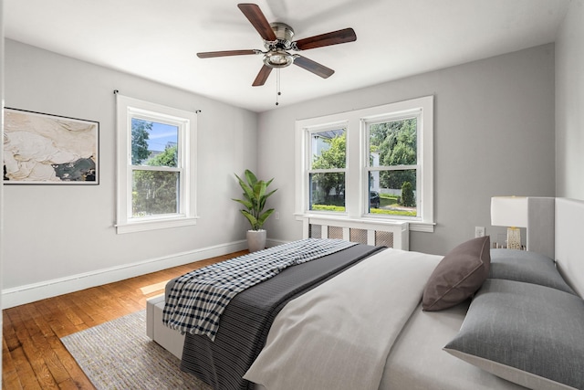 33 Hayes Ave, Manchester, NH 03103 - bedroom with baseboards, hardwood / wood-style floors, ceiling fan, and radiator