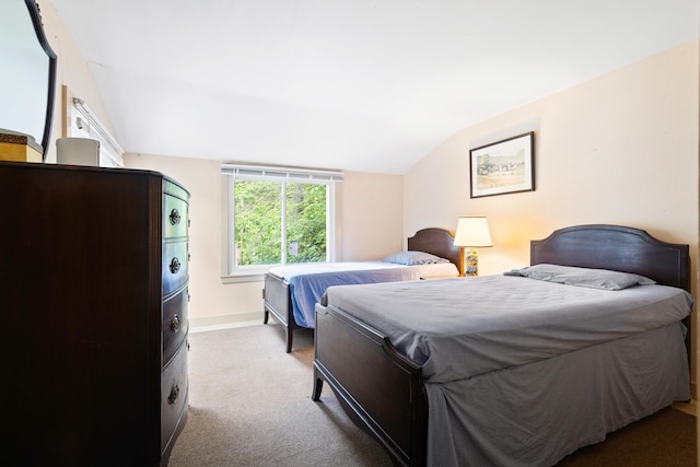 183 Mountain View Rd, Whitefield, NH 03598 - carpeted bedroom with lofted ceiling and baseboards