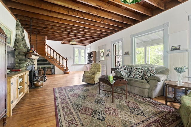 183 Mountain View Rd, Whitefield, NH 03598 - living room featuring stairs, wood finished floors, and wood ceiling with exposed beams