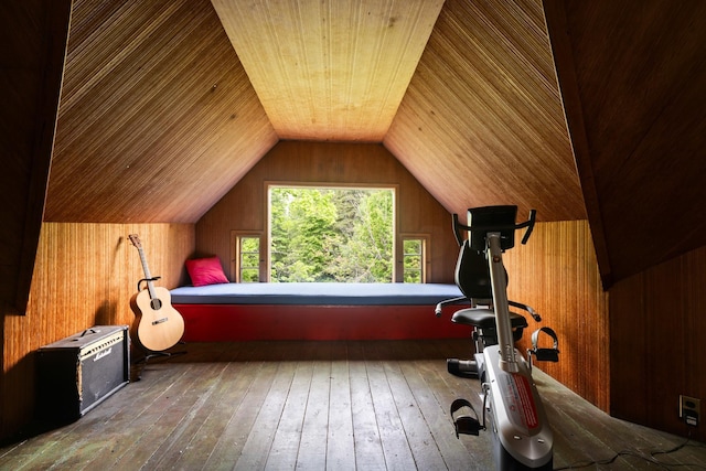 183 Mountain View Rd, Whitefield, NH 03598 - bedroom with hardwood / wood-style flooring, vaulted ceiling, and wood walls