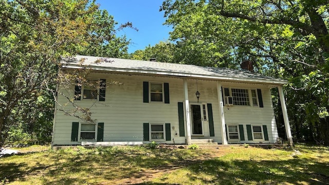 36 Summit Dr, Atkinson, NH 03811 - bi-level home featuring a chimney and a front lawn