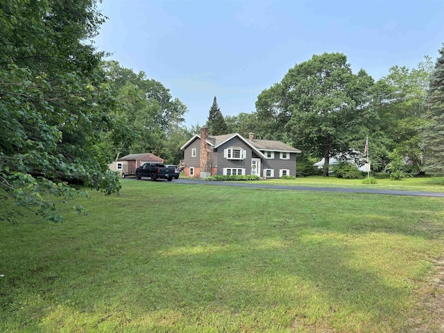 4 Mount Vernon Dr, Pelham, NH 03076 - view of front of home featuring a chimney and a front lawn