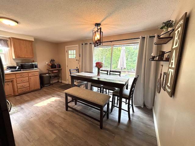 4 Mount Vernon Dr, Pelham, NH 03076 - dining room with a textured ceiling, wood finished floors, baseboards, and a chandelier