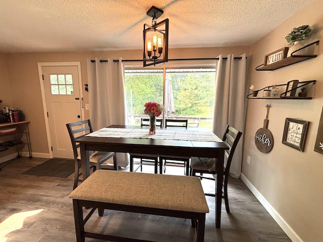 4 Mount Vernon Dr, Pelham, NH 03076 - dining area with a textured ceiling, baseboards, dark wood finished floors, and a chandelier