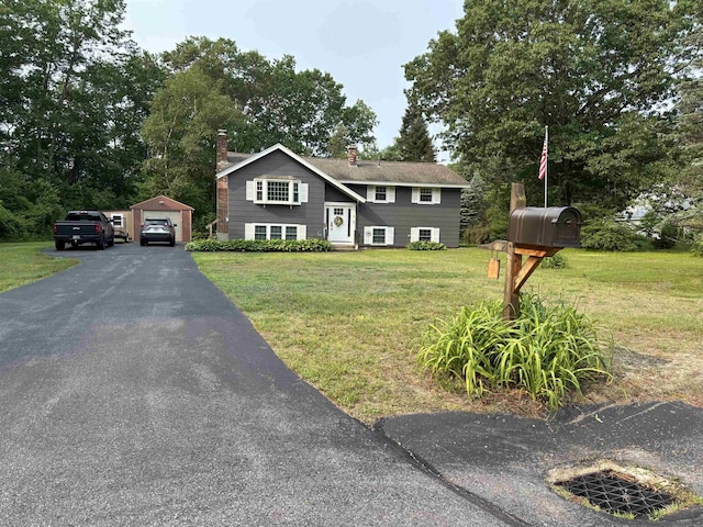 4 Mount Vernon Dr, Pelham, NH 03076 - bi-level home with a chimney, an outdoor structure, a front yard, a garage, and driveway