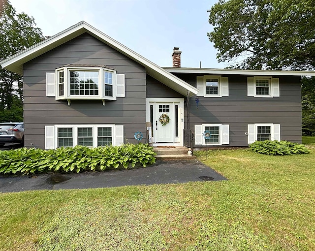 4 Mount Vernon Dr, Pelham, NH 03076 - raised ranch with a chimney and a front yard