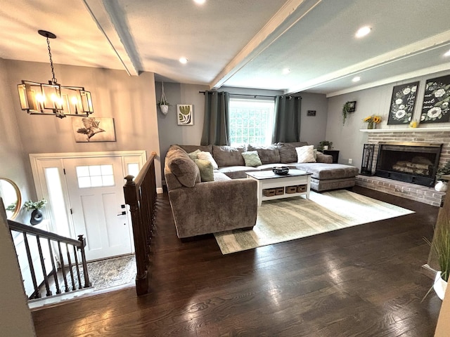 4 Mount Vernon Dr, Pelham, NH 03076 - living room featuring beam ceiling, wood finished floors, a chandelier, a brick fireplace, and recessed lighting