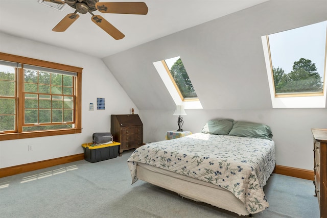 190 Ledge Hill Rd, Tuftonboro, NH 03816 - carpeted bedroom with a skylight, baseboards, vaulted ceiling, and a ceiling fan