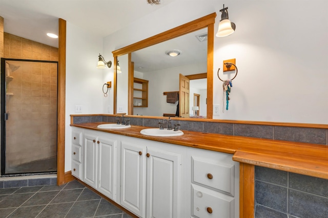190 Ledge Hill Rd, Tuftonboro, NH 03816 - full bath with double vanity, a stall shower, and tile patterned floors