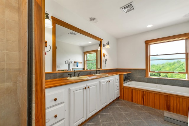 190 Ledge Hill Rd, Tuftonboro, NH 03816 - full bathroom with double vanity, a garden tub, tile patterned floors, recessed lighting, and tiled shower